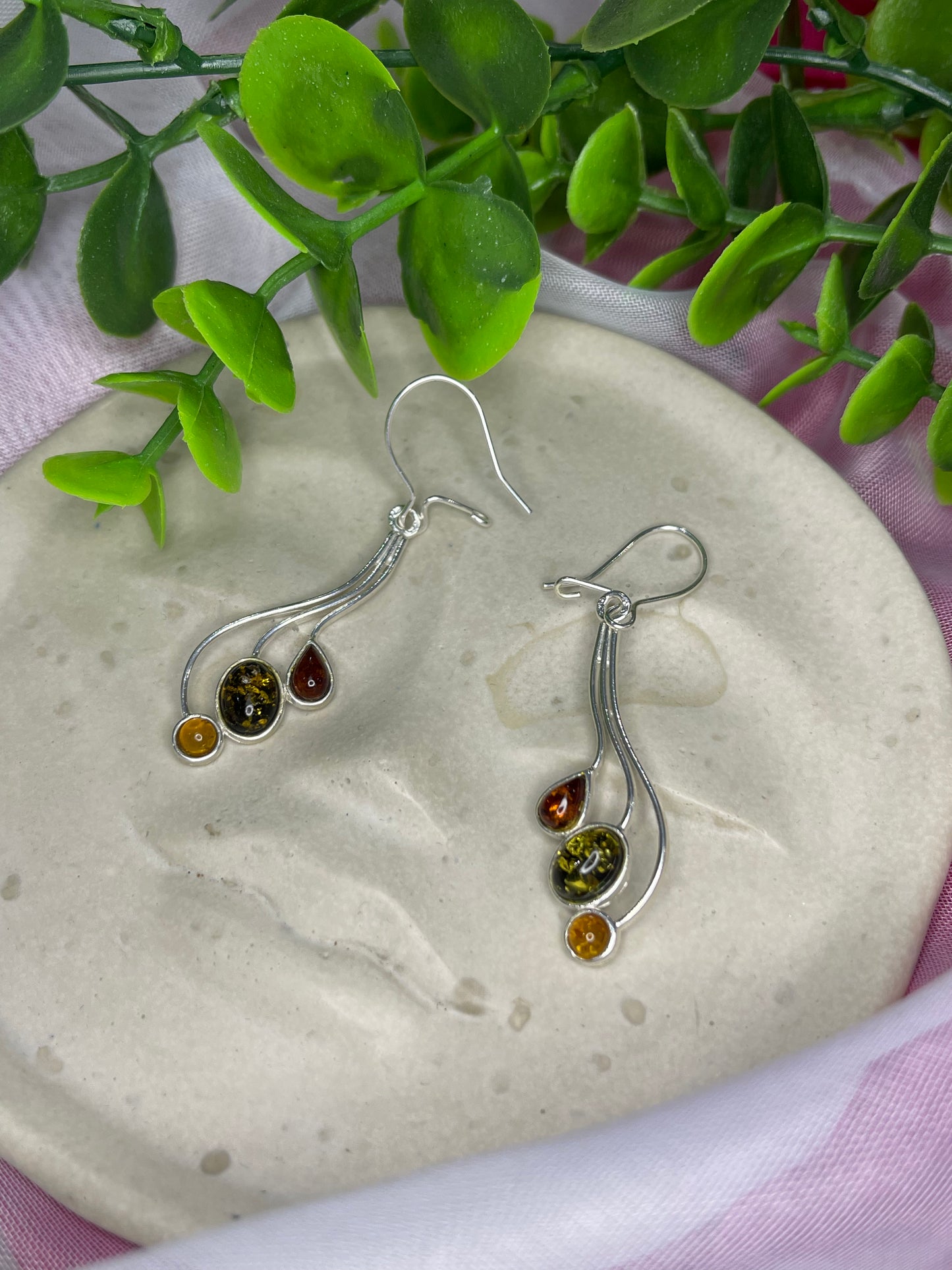 Three amber colour drop earrings