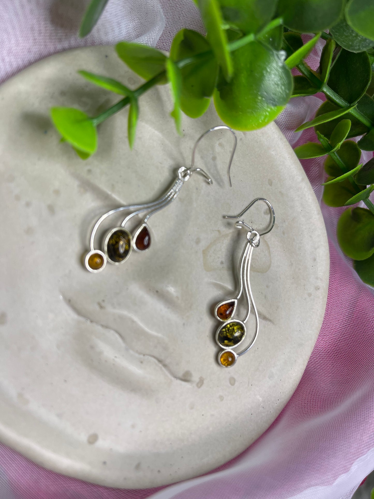 Three amber colour drop earrings