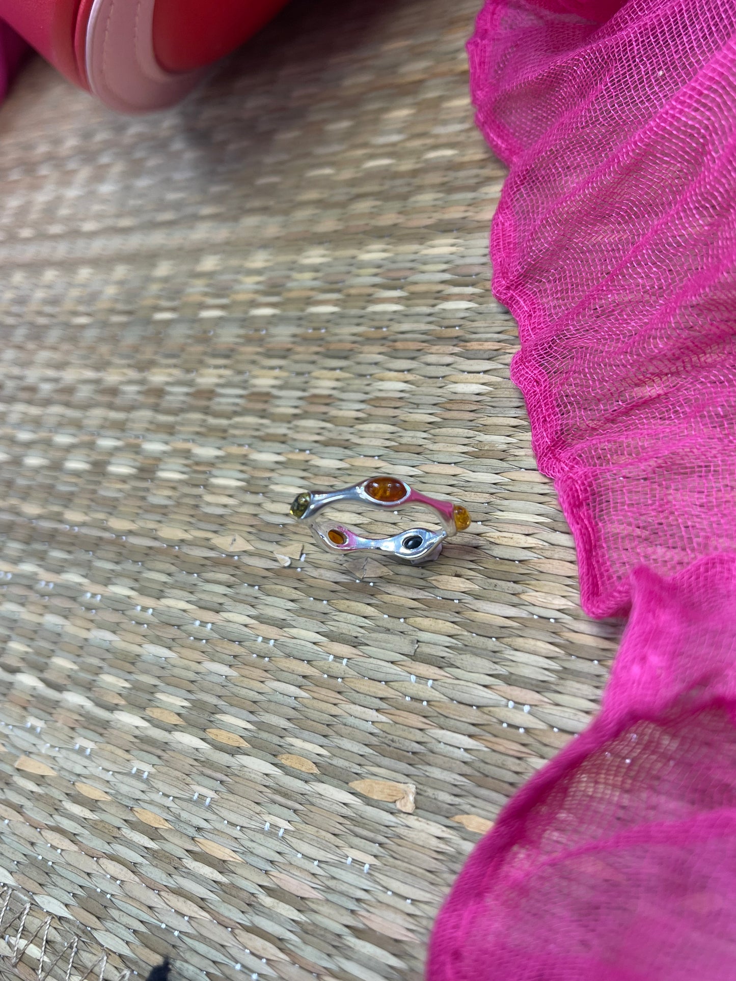 Sterling silver ring with oval green, yellow and brown amber stones going around the band SIZE O
