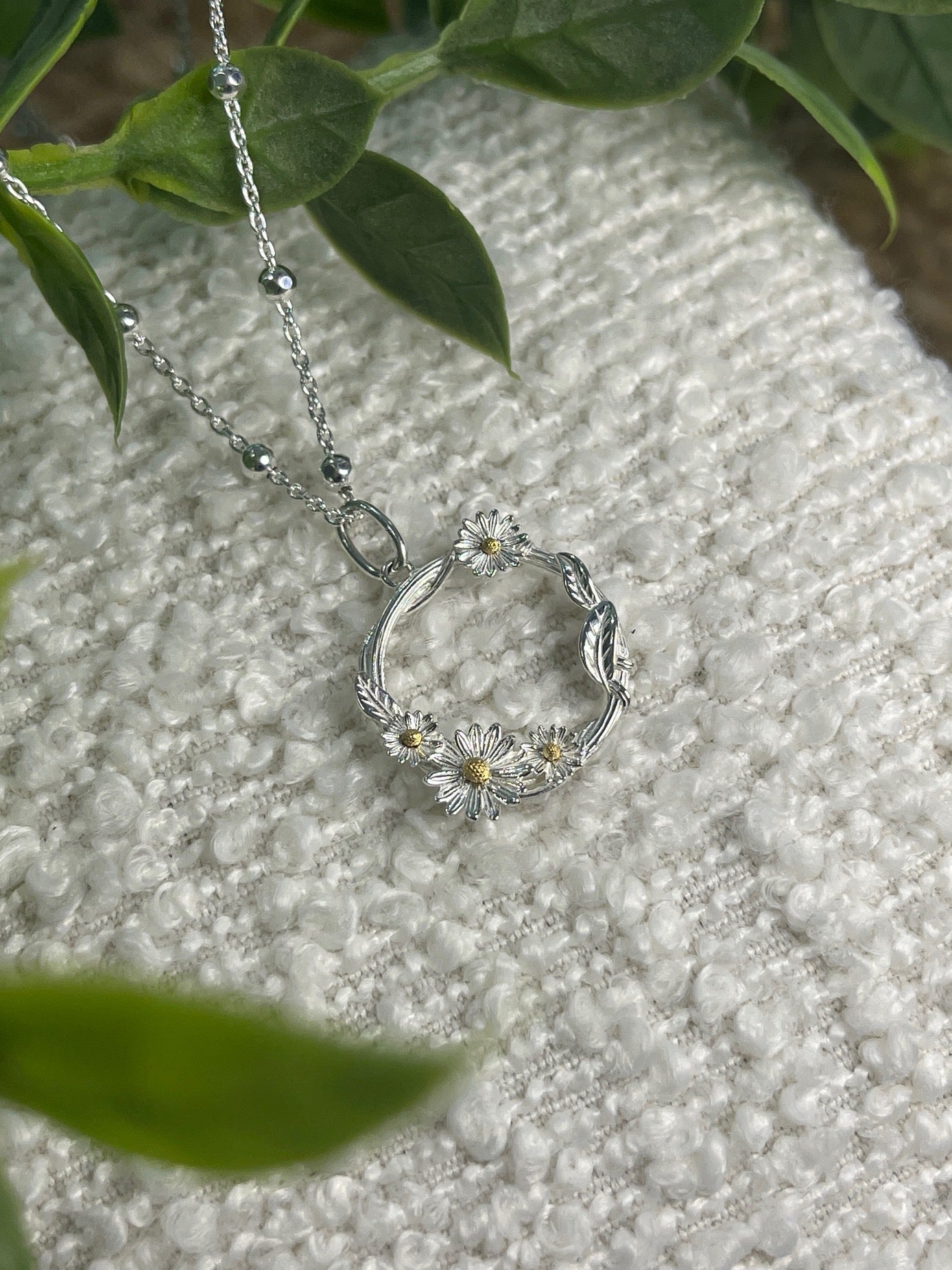 Daisy wrapped vine open circle necklace on beaded chain