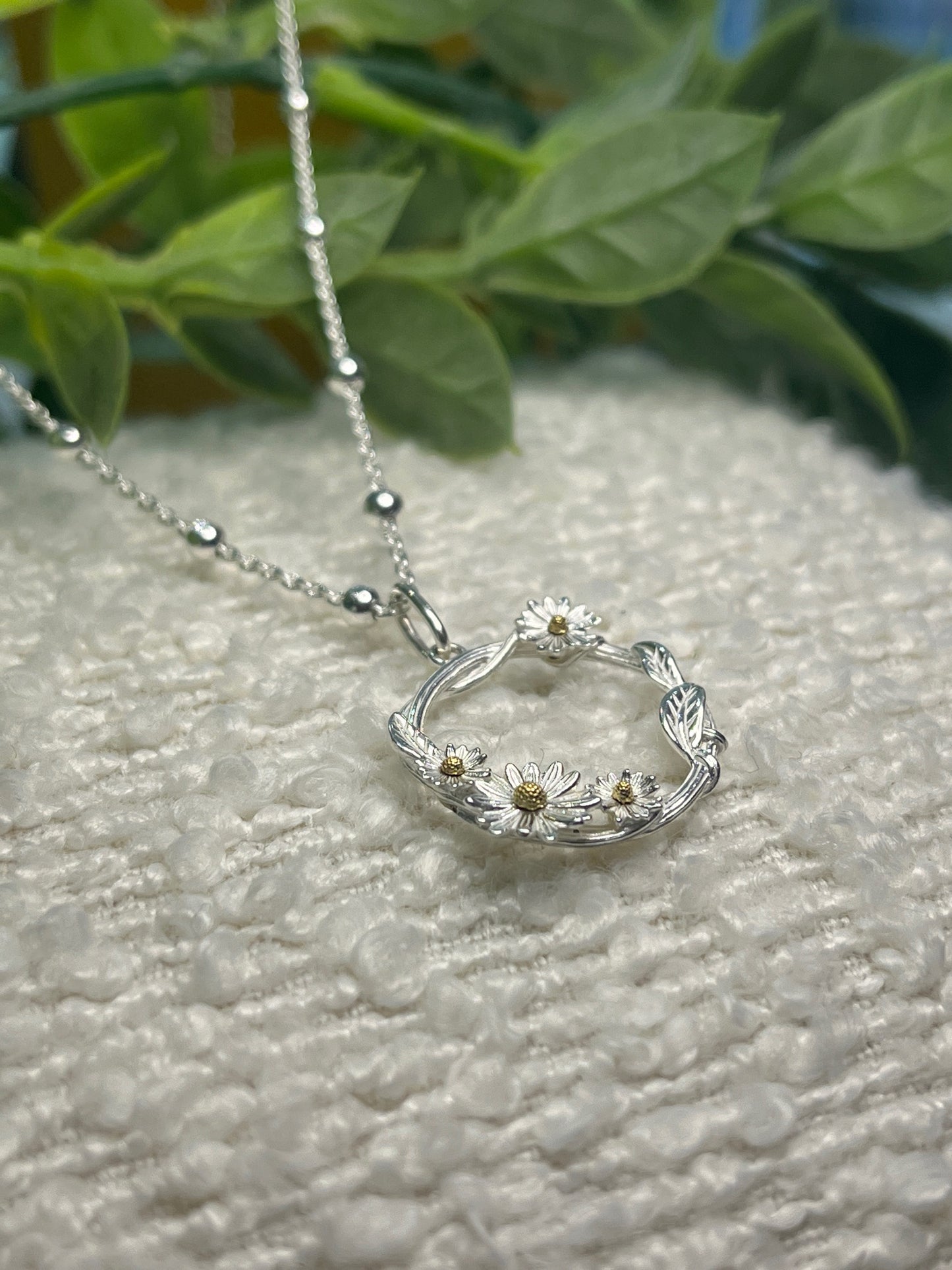 Daisy wrapped vine open circle necklace on beaded chain